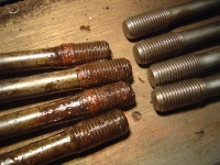 head bolts before and after - some sealant used last time?